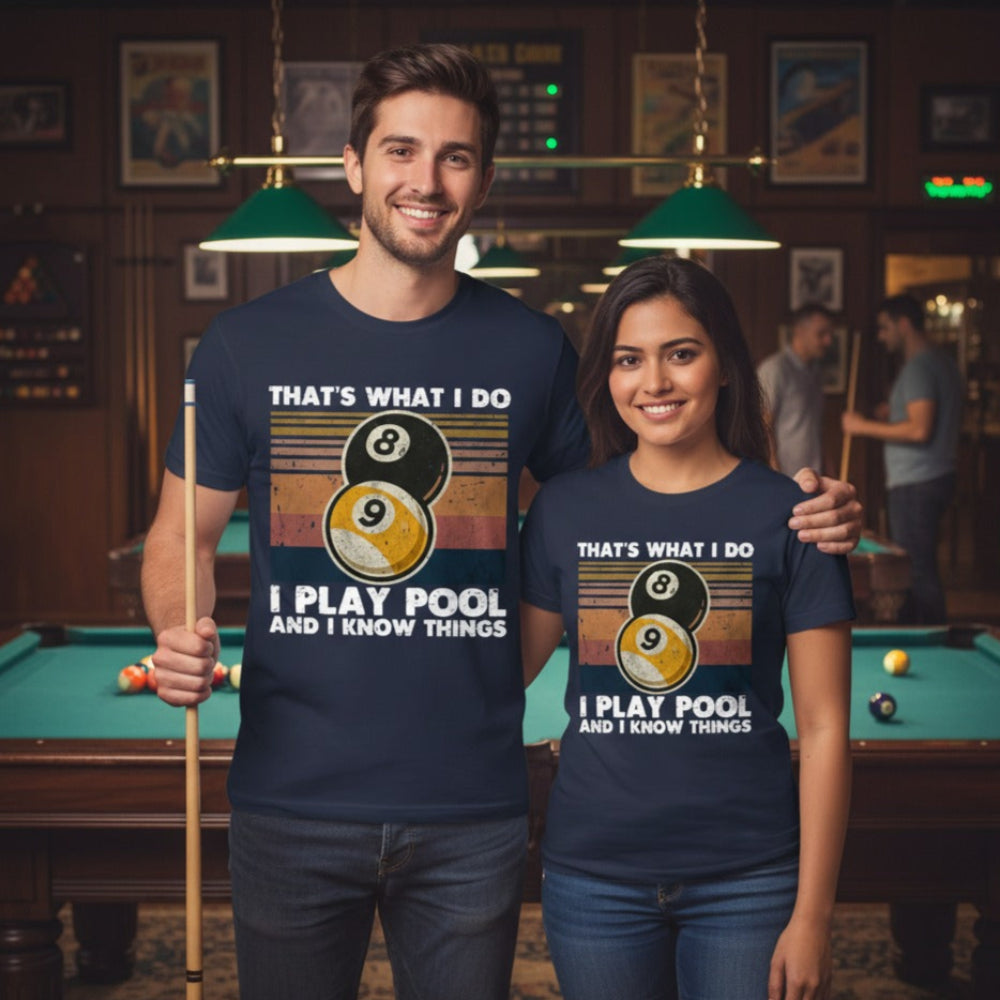 Two people wearing matching t-shirts with a pool theme in a billiards hall.