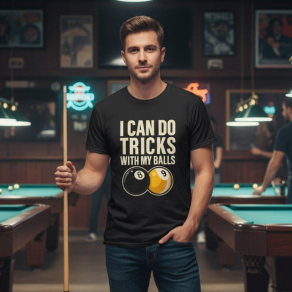 Man wearing a black t-shirt with a humorous pool-themed design in a billiards hall.